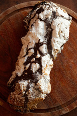 chocolate cigar pastry pastries baked goods bakery powdered sugar chocolate cinnamon cocoa hands...
