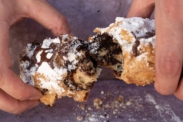 chocolate cigar pastry pastries baked goods bakery powdered sugar chocolate cinnamon cocoa hands...