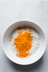  Cheddar cheese powder and flour in a white mixing bowl, making cheddar cheese bread	