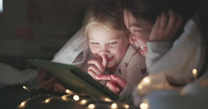 Tablet, night and search with children in bedroom for storytelling, streaming and watching movies. Happy, internet and technology with kids relax in family home for subscription, online and media