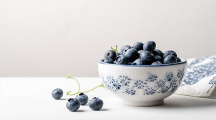 Blueberries in a bowl isolated on a white background. Fresh juicy blueberries. Healthy food concept.