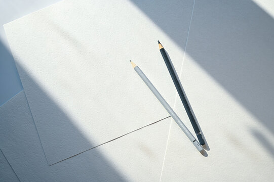 White blank sheets of a4 paper. Layout of documents with a pencil on a white table. Template for design