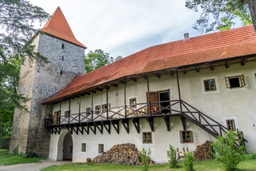 Fototapeta na wymiar Inner courtyard, second gate tower, gothic building with wooden balcony at Zvikov medieval castle in Czechia