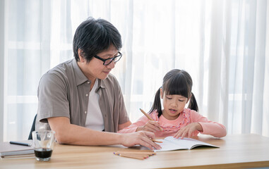 Portrait of father and daughter learning to write, daddy teaching little girl homework isolated on white background, Education study home school father's day concept banner