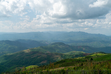 Beautiful mountain scenery, green trees and blue sky. in the northern provinces of Thailand adjacent to the border
