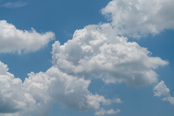 Naklejka na ściany i meble Blue sky with big clouds floating