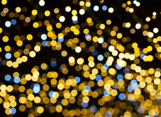 Golden circular bokeh on blurred background