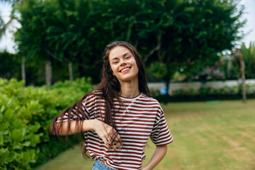 Fototapeta premium summer woman walk t-shirt freedom beautiful nature smiling wellness lifestyle park