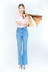 Portrait isolated cutout studio full body shot of Asian cheerful female clients customers shoppers in casual outfit buying holding paper shopping bags in department store on white background