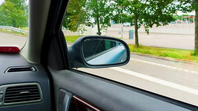 4K 60FPS Cinematic View of Car Side Mirror Driving on Highway in Sweden - Handheld Shot