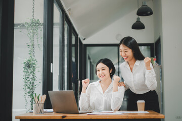 Beautiful two asian girl celebrate with laptop, success happy pose, E-commerce, university...