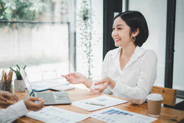 Businesswoman discussing with colleagues in the office, job interview.