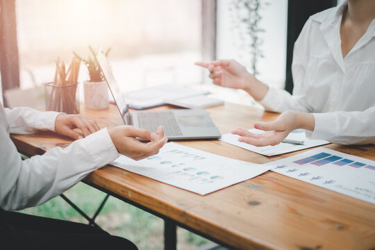 Group of business people analysis summary graph reports of business operating expenses and work data about the company's financial statements.