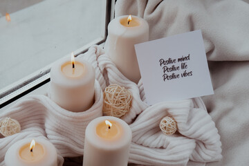POSITIVE MIND POSITIVE LIFE POSITIVE VIBES text saying phrase on paper note on background of Home...