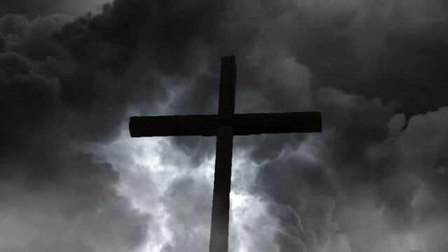 wooden cross amidst storm clouds background.