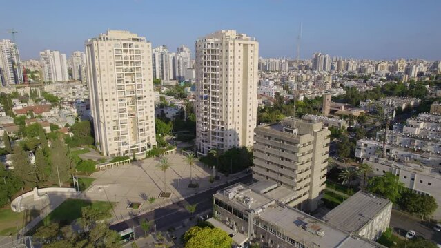 Holon's old city hall next to modern residential towers - parallax shot