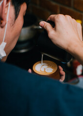 barista making coffee process latte art