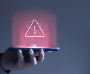 hacker attack maintenance concept and hacking cybercrime cyber security User is using smartphone with warning triangle for error notification. - obrazy, fototapety, plakaty
