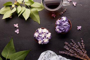 Aesthetic french purple floral cupcakes using trend Dreamy Escapism. Coffee time among flowers