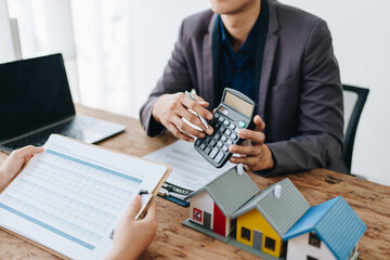 Guarantee, mortgage, contract, contract, signed, real estate agent or bank officer holding a...