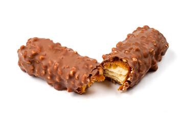 A chocolate bar broken in half with a filling on a white background. Close-up chocolate bar isolated on a white background.