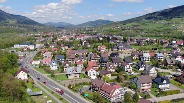Mszana Dolna village in Southern Poland on sunny summer day, aerial panorama