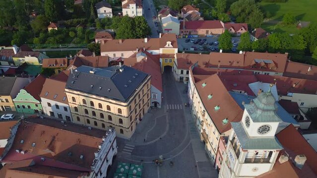 Historic city gate Market square, fountain. Spectacular aerial top view flight. 
town Trebon Wittingau, Bohemia czech republic Europe, summer 2023. 
overflight flyover drone 4K uhd cinematic footage.