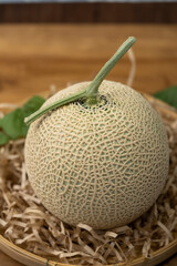 Premuim Crown Musk Melon on wooden background, Shizuoka Crown Melon Yama Grade on wooden background.