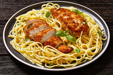 crusted chicken over lemon butter pasta, top view