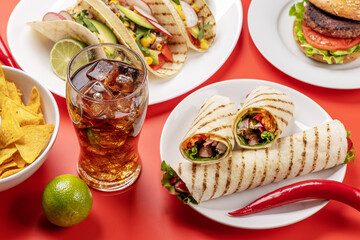 Mexican food featuring tacos, burritos, nachos, burgers