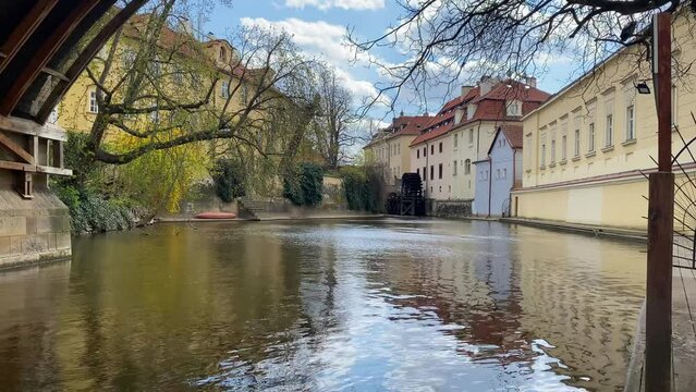 The old watermill are reflected in the narrow river Devil