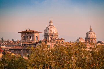 Fototapeta na wymiar View of the skyline of Rome with domes from different churches, Italy