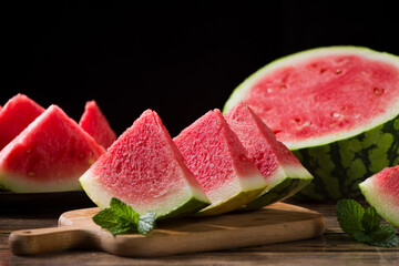 Fresh sliced watermelon on wooden background