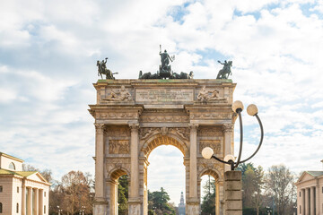Fototapeta premium Arco della Pace triumphal arch in Milan with clowdy sky, Italy