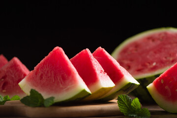 Fresh sliced watermelon on wooden background