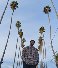 African American Man Embracing Nature's Beauty Amongst Trees