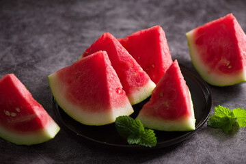 Fresh sliced watermelon on wooden background