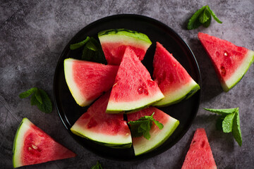 Fresh sliced watermelon on wooden background