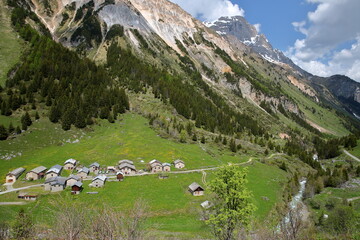 Fototapeta na wymiar Aerial view of the hamlet Les Prioux, located along the Chaviere valley above Pralognan la Vanoise, gateway to the Vanoise National Park, Northern French Alps, Tarentaise, Savoie, France