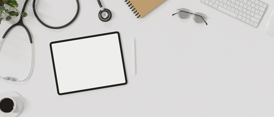 Top view of minimal doctor workspace with with blank screen mock up tablet on the table.