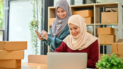 Young Muslim online start up business team working together