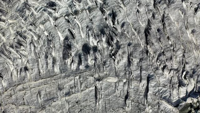 Drone footage, Rakaposhi Pakistan. Cinematic downward angle on glacier ice. Karakoram mountain range in the Gilgit-Baltistan territory. Aerial shot.