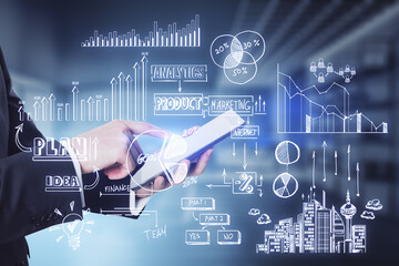 Close up of businessman hands holding tablet with creative toned business sketch on blurry office interior background. Business strategy and finance concept.