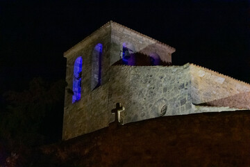 catholic church steeple overhead at night
