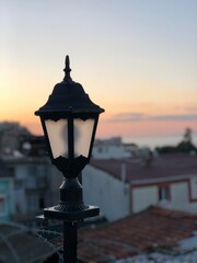 Naklejka premium old street lamp on a rooftop in Istambul