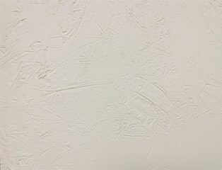Abstract backdrop in a light tone. A light gray wall with a textured surface. Relief plaster.