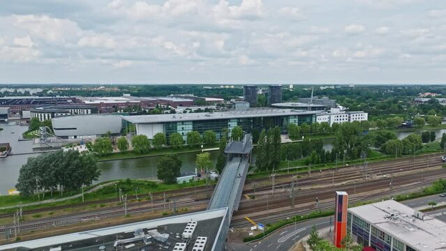 Drone shot of a modern glass building in autostadt , Wolfsburg , Germany