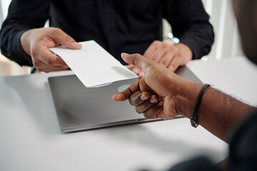 Information security officer giving document with nda to new employee