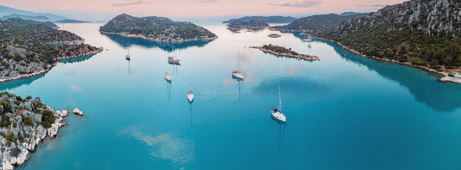 Aerial view of seacoast with many yachts and sailing boats - obrazy, fototapety, plakaty