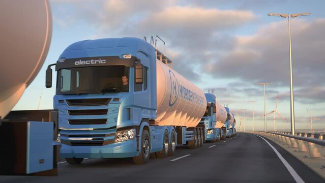 Convoy of generic electric semi trucks with hydrogen tank trailer driving along a bridge or coastal highway with wind turbines in background. Renewable energies concept. Realistic 3d animation.
